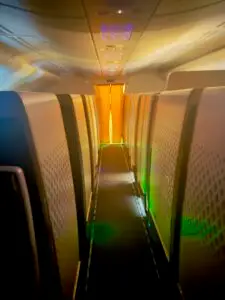 View down the aisle of Etihad First from the shower