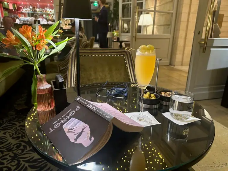 Cocktails and a book on a table