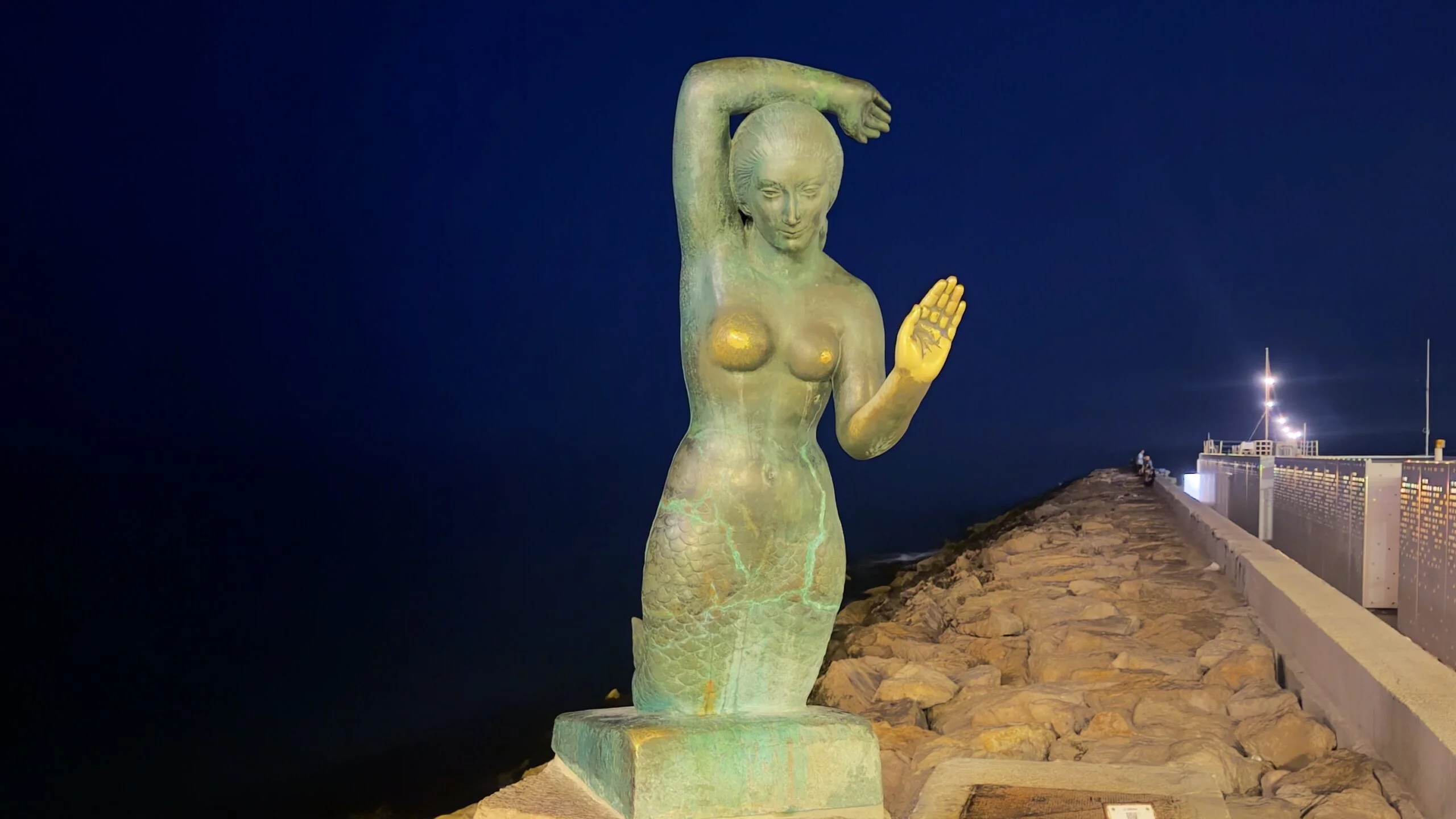 Sitges brass mermaid at night